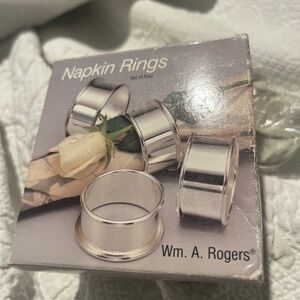 Wm. A. Rogers Silverplate (4) Napkin Rings Set New in box. Box has wear